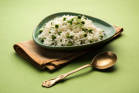 Basmati Rice Pilaf or pulav with Peas, or vegetable rice using green peas also known as matar pulav, served with plain dalの写真素材