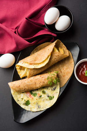 omelette / omelette chapati roll or Indian bread or roti rolled with omlet. Popular, quick and...