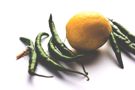 lemon chilies hanging - Indian superstitious lemon and green chillies tied with thread and tied on...
