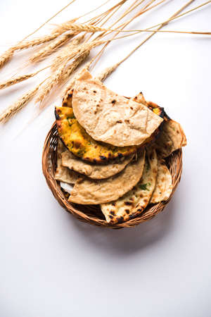 Assorted Indian Bread Basket includes chapati, tandoori roti or naan, paratha, kulcha, fulka, missi...