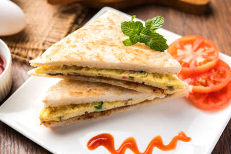Indian Bread omelette / omlet / omlete sandwich served with tomato ketchup