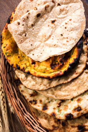 Assorted Indian Bread Basket includes chapati, tandoori roti or naan, paratha, kulcha, fulka, missi...