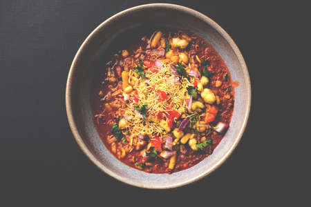 Misal Pav or misalpav, Misal Pav with Farsan. Traditional Indian spicy dish made with moth beans (match) and served with farina and breadの写真素材