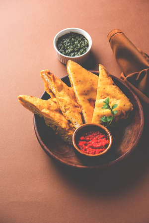 Bread Pakora or Bread Pakoda or bhaji served along with Green Chutney and tomato ketchup. selective focusの写真素材