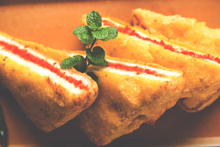 Bread Pakora or Bread Pakoda or bhaji served along with Green Chutney and tomato ketchup. selective focusの写真素材