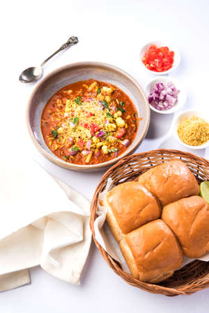 Misal Pav or misalpav, Misal Pav with Farsan. Traditional Indian spicy dish made with moth beans...
