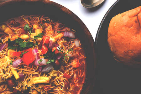 Misal Pav or misalpav, Misal Pav with Farsan. Traditional Indian spicy dish made with moth beans (match) and served with farina and breadの写真素材