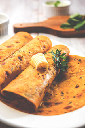Methi Paratha (Thepla) / Indian flat bread using fenugreek leaves, selective focus