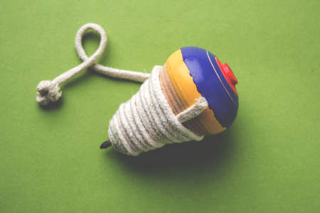 Lattu, Bhovra, Bambaram / Pambaram / Buguri / bhavra is a traditional throwing top used mainly in India and Pakistan. In Telangana, its name is Bongaralu Aataの写真素材