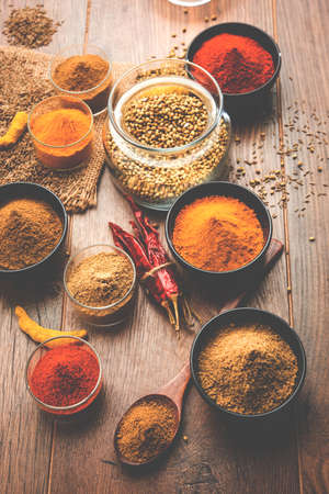 Indian colourful spices. Group photo of four basic Indian spices like raw red chilli, turmeric, coriander and cumin powder. selective focusの写真素材