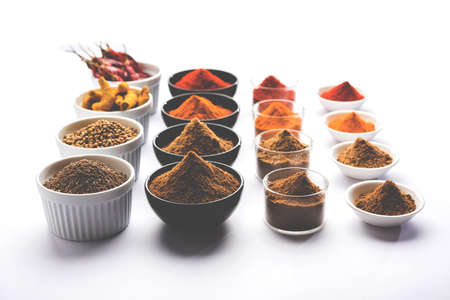 Indian colourful spices. Group photo of four basic Indian spices like raw red chilli, turmeric,...