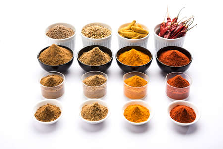 Indian colourful spices. Group photo of four basic Indian spices like raw red chilli, turmeric,...