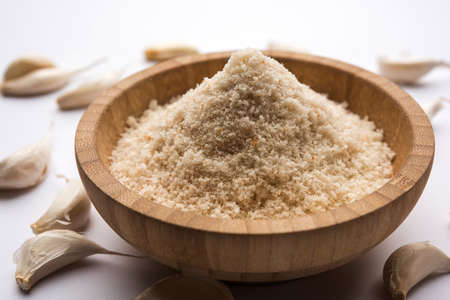 Garlic powder is ground, dehydrated garlic. It's a common seasoning  for pasta, pizza and grilled chicken.の写真素材