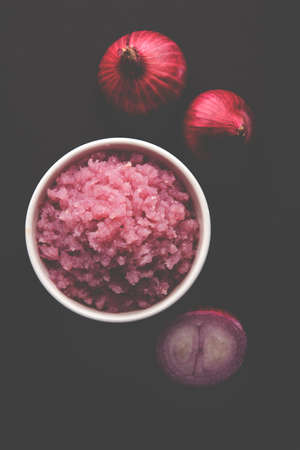Onion Sauce or paste, in white or black ceramic bowl with raw cut onions, isolated over white background. Selective focusの写真素材