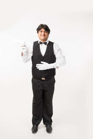 Asian Indian waiter or Bartender isolated over white background, selective focus