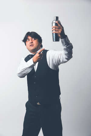 Asian Indian waiter or Bartender isolated over white background, selective focusの写真素材