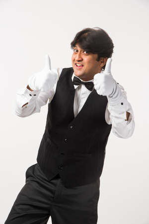 Asian Indian waiter or Bartender isolated over white background, selective focusの写真素材