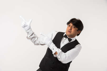 Asian Indian waiter or Bartender isolated over white background, selective focusの写真素材