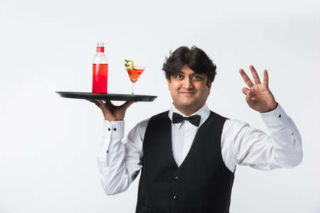 Asian Indian waiter or Bartender isolated over white background, selective focusの写真素材