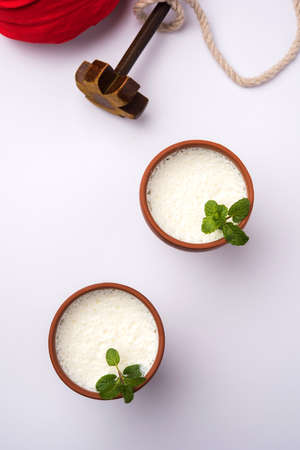 Lassie or lassi in terracotta glass - Lassi is an Authentic Indian cold drink made up of curd and...