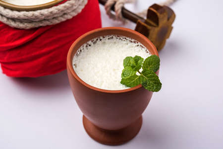 Lassie or lassi in terracotta glass - Lassi is an Authentic Indian cold drink made up of curd and milk and sugar, selective focusの写真素材