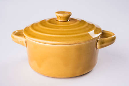 brown empty ceramic bowl or container with lid or barni, isolated over plain backgroundの写真素材