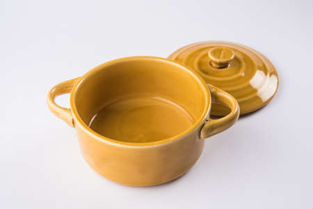 brown empty ceramic bowl or container with lid or barni, isolated over plain background