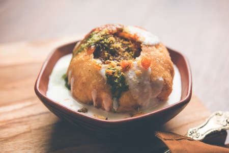 Shahi Raj Kachori is a popular chat item from Rajasthan served in terracotta bowl, India