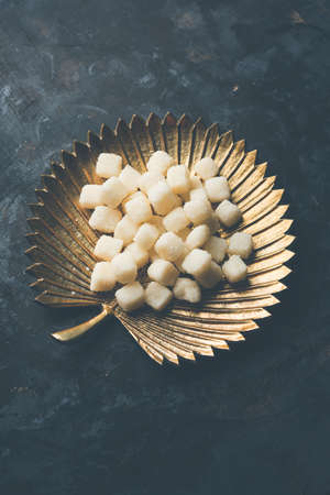 Bengali Sweet Chena Murki served in a golden plate, selective focusの写真素材