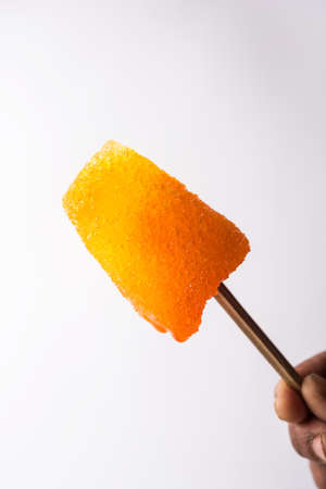 Chuski Or Baraf ka Gola also known as Ice candy, popular roadside refreshment in Indian summerin kala khatta, orange and mixed flavourの写真素材