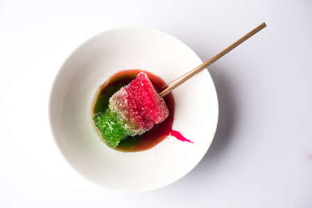 Chuski Or Baraf ka Gola also known as Ice candy, popular roadside refreshment in Indian summerin kala khatta, orange and mixed flavourの写真素材