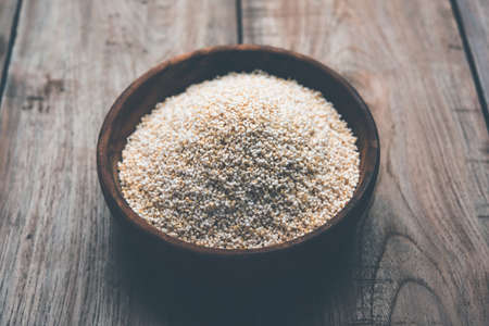 Amaranth or rajgira lahi in a bowl with sweet laddu. selective focusの写真素材
