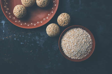 Amaranth or rajgira lahi in a bowl with sweet laddu. selective focusの写真素材