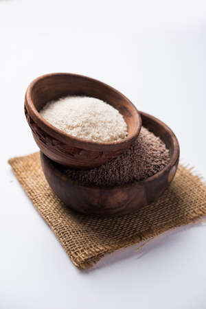 Psyllium husk or isabgol which is fiber derived from the seeds of Plantago ovata, mainly found in India. Served in a bowl over moody background. selective focusの写真素材