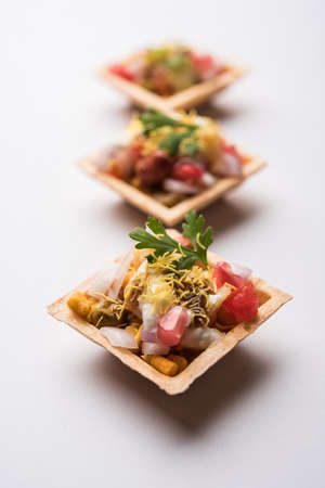 Crispy Canape or canapÃ© is a starter recipe from India - Round or square shaped Puri Filled with Yogurt and potato , chat, sev, tamarind sauce etc. selective focusの写真素材