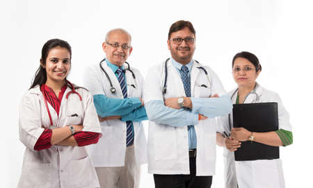 Group of Indian medical doctors, male and female standing isolated on white background, selective...