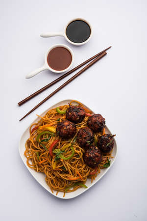 Manchurian Hakka / Schezwan noodles, popular indochinese food served in a bowl. selective focusの写真素材