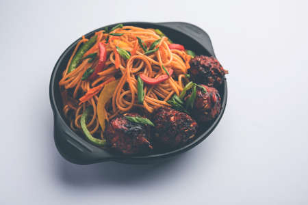 Manchurian Hakka / Schezwan noodles, popular indochinese food served in a bowl. selective focusの写真素材