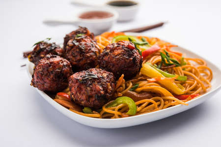 Manchurian Hakka / Schezwan noodles, popular indochinese food served in a bowl. selective focusの写真素材