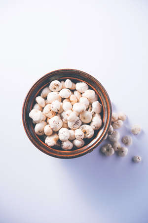 Makhana, also called as Lotus Seeds or Fox Nuts are popular dry snacks from India, served in a bowl. selective focusの写真素材