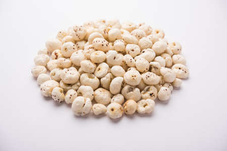 Makhana, also called as Lotus Seeds or Fox Nuts are popular dry snacks from India, served in a bowl....