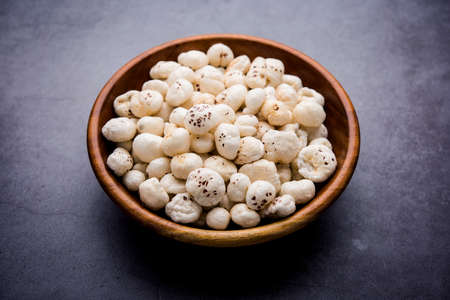 Makhana, also called as Lotus Seeds or Fox Nuts are popular dry snacks from India, served in a bowl. selective focusの写真素材