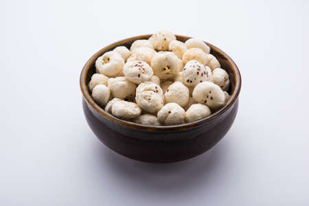 Makhana, also called as Lotus Seeds or Fox Nuts are popular dry snacks from India, served in a bowl....