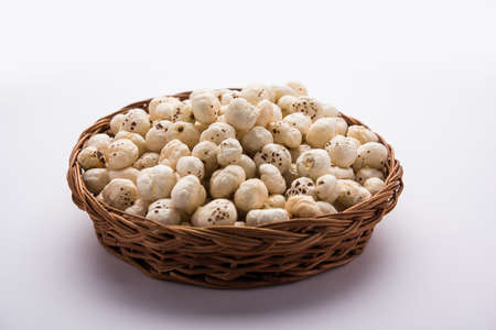 Makhana, also called as Lotus Seeds or Fox Nuts are popular dry snacks from India, served in a bowl. selective focusの写真素材