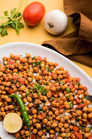 Black Chickpea Chaat or Kala Chana Chat recipe is a popular snack recipe from India, served in a...
