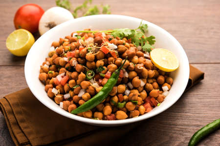 Black Chickpea Chaat or Kala Chana Chat recipe is a popular snack recipe from India, served in a bowl. selective focusの写真素材