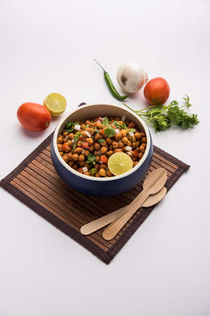 Black Chickpea Chaat or Kala Chana Chat recipe is a popular snack recipe from India, served in a...