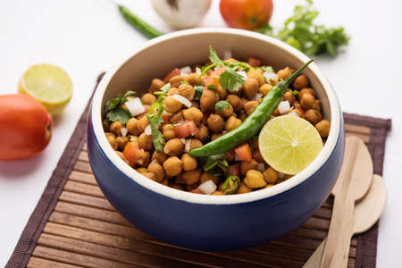 Black Chickpea Chaat or Kala Chana Chat recipe is a popular snack recipe from India, served in a bowl. selective focusの写真素材