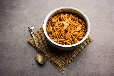 Aloo Chivda or Potato Chiwda also known as Falahari Namkeen for Vrat.Â  Traditional Fasting snack recipe from India, garnished with Cashew Nuts and Almondsの写真素材