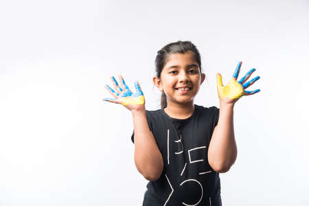 Cute Little Girl Showing Painted Hand or Colourful Palmの写真素材
